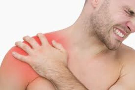 Man holding Shoulder in pain