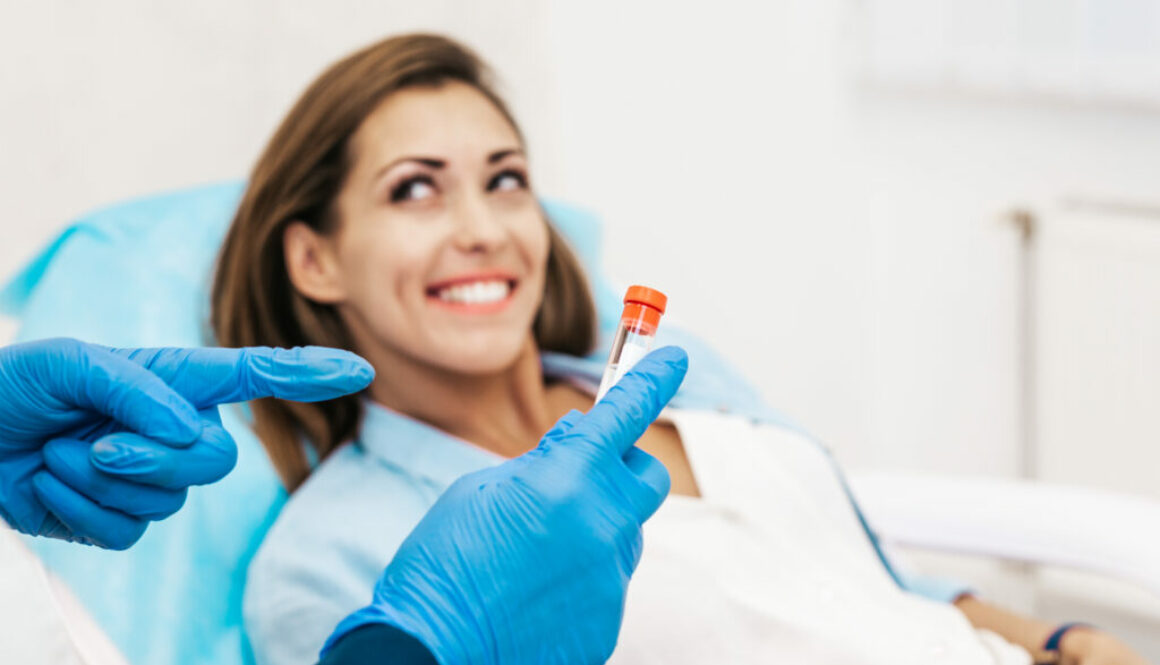 A woman smiles as doctor explains Platelet rich plasma ( PRP) therapy process.